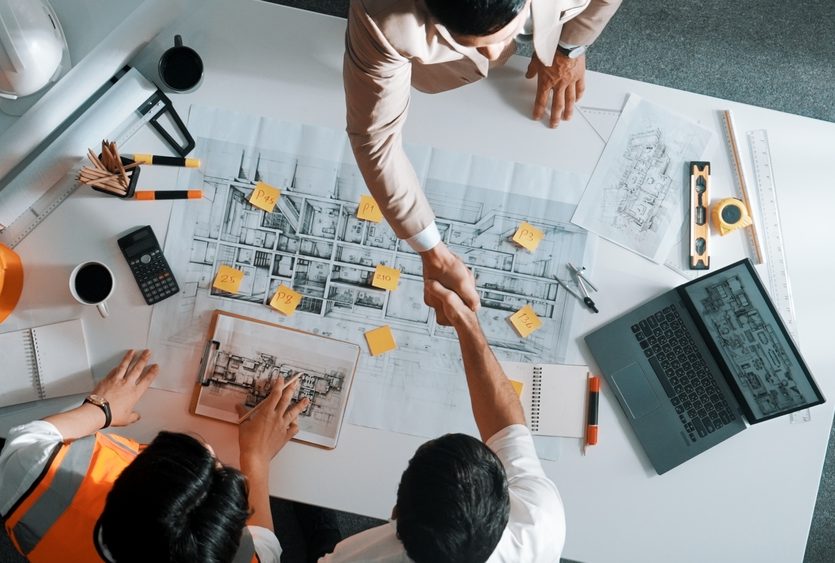Top,Down,Aerial,View,Of,Architect,Engineer,Team,Shake,Hands Top,Down,Aerial,View,Of,Architect,Engineer,Team,Shake,Hands